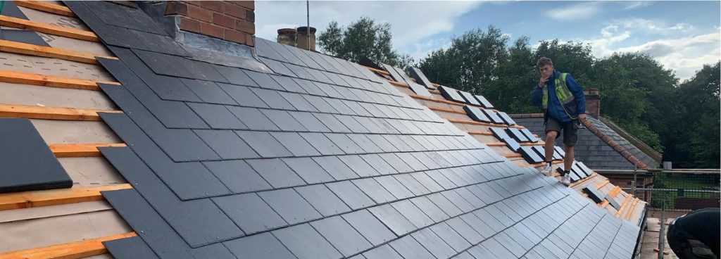 Close-up of a slate roof slope during an inspection